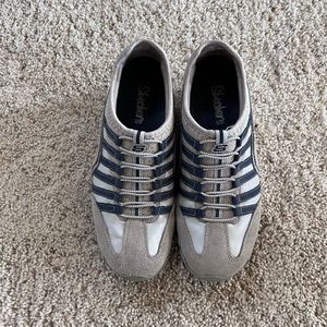 Skechers Size 7 tan with blue stripes in fair condition.